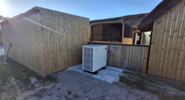 SPRSUN Ocean Series pool heat pump installed beside European backyard pool